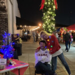 Kyle Williams (Education manager) and Lorren West (Director) celebrate Pascagoula's Downtown Christmas Celebration 2021
